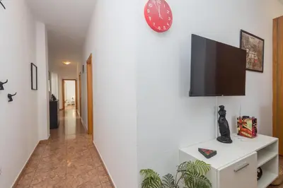 Una televisión o centro de entretenimiento en Piso de 3 habitaciones en Agüimes