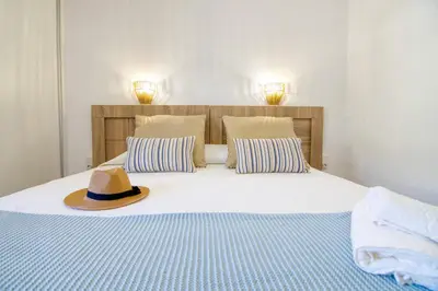 Cama o camas de una habitación en La Perla de Monterrey by Homestaygrancanaria