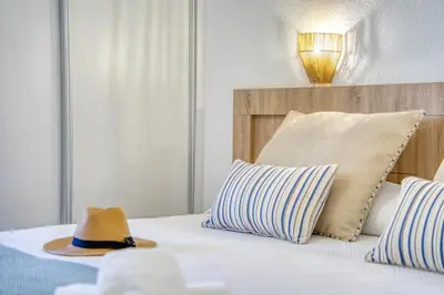 Cama o camas de una habitación en La Perla de Monterrey by Homestaygrancanaria