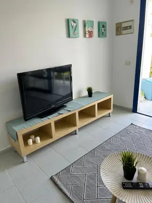 Una televisión o centro de entretenimiento en Pool Front Playmar Maspalomas