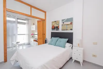 Cama o camas de una habitación en Las Canteras Cozy Apt - 2 min walk to beach