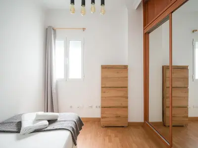 Cama o camas de una habitación en Moderno piso de 3 habitaciones cerca de Triana