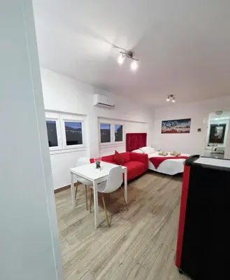 Una televisión o centro de entretenimiento en Alojamientos Agaete Pueblo Nº1 y Nº2