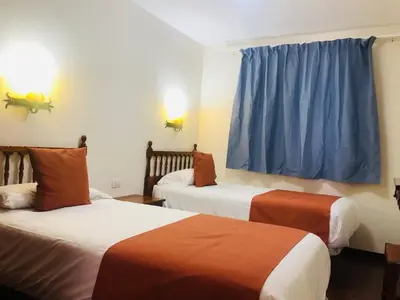Cama o camas de una habitación en Alsol Las Orquídeas