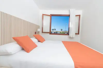 Cama o camas de una habitación en Alsol Las Orquídeas