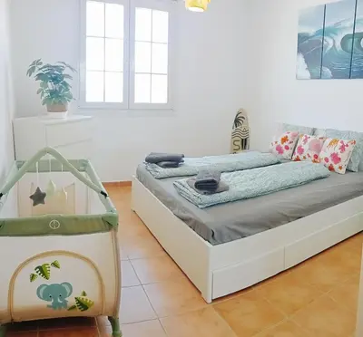 Cama o camas de una habitación en Piso magico junto al mar con gran terraza