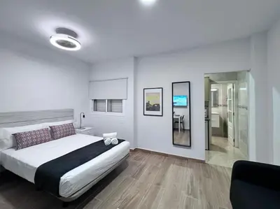 Cama o camas de una habitación en Riquiño-Estudio playa Canteras