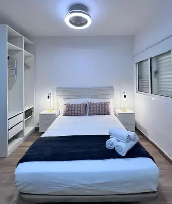 Cama o camas de una habitación en Riquiño-Estudio playa Canteras