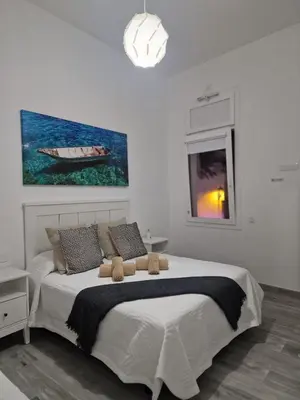 Cama o camas de una habitación en Alojamientos Agaete Pueblo Nº13