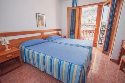 Cama o camas de una habitación en CityHub Vacational Home Montecarlo 39 Puerto Rico