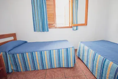 Cama o camas de una habitación en CityHub Vacational Home Montecarlo 39 Puerto Rico
