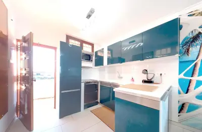 Una cocina o zona de cocina en Sunandsea Apartment