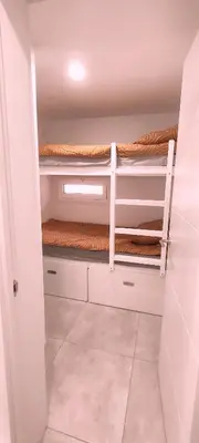 Cama o camas de una habitación en Aida - Apartamento con vistas al jardín junto a la playa