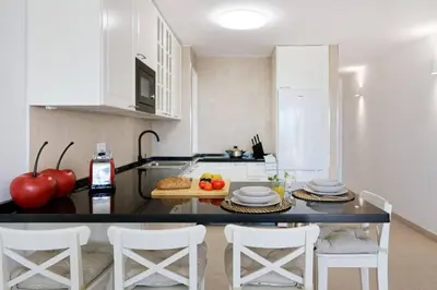 Una cocina o zona de cocina en Amapola Miranda -recién reformado, frente al mar