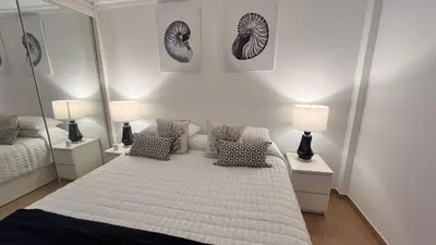 Cama o camas de una habitación en VV Janoa Playa Las Canteras 1
