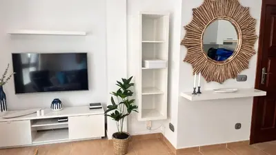 Una televisión o centro de entretenimiento en VV Janoa Playa Las Canteras 1