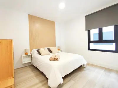 Cama o camas de una habitación en Luxury Apartments Las Canteras