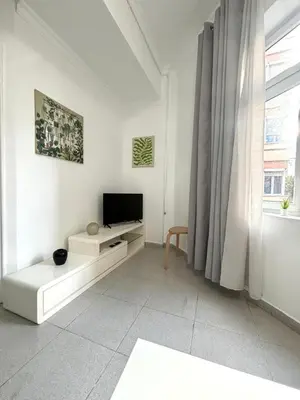 Una televisión o centro de entretenimiento en Luis Morote 2-C Apartamentos