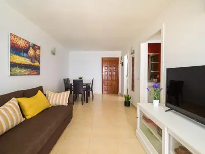Una televisión o centro de entretenimiento en Amanecer Playa Patalavaca