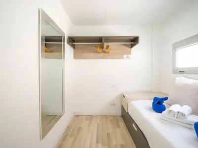 Cama o camas de una habitación en Beyond Amadores 12