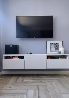 Una televisión o centro de entretenimiento en Cosy Apartment at Sardina Beach
