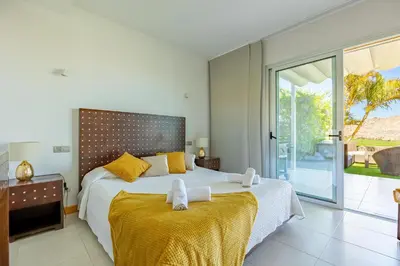 Cama o camas de una habitación en Villa Salobre Golf - by Gestión Vacacional Canarias