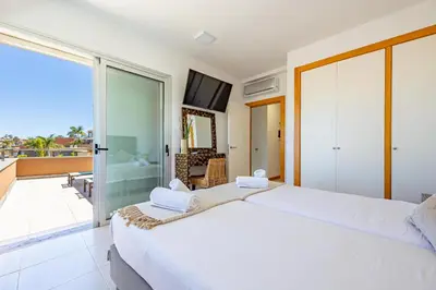 Cama o camas de una habitación en Villa Salobre Golf - by Gestión Vacacional Canarias