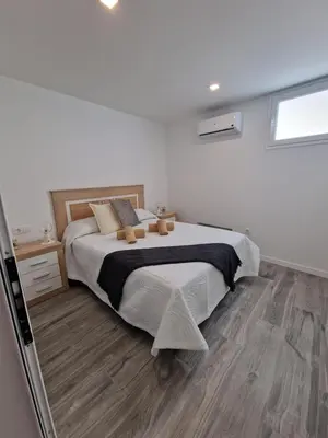 Cama o camas de una habitación en Alojamientos Agaete Pueblo Nº14