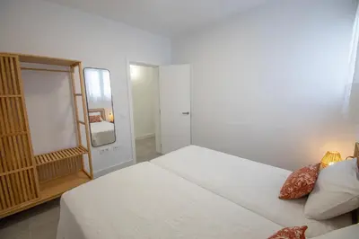 Cama o camas de una habitación en Apartamentos Marmolejos