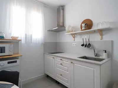 Una cocina o zona de cocina en Apartamentos Marmolejos