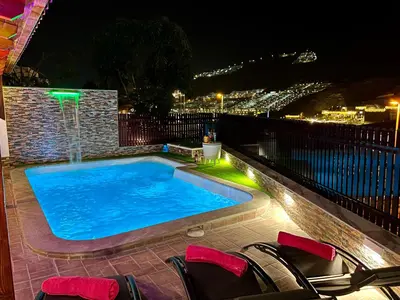 Piscina en o cerca de Villa Puerto Rico in front of the shopping center with private heated saltwater pool with jacuzzi function & arcade games OR St andard Villa Puerto Rico in front of the shopping center with private heated saltwater large jacuzzi No Pool& arcade games