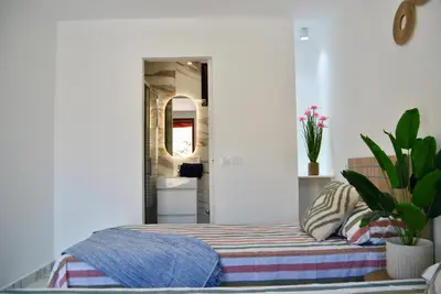 Cama o camas de una habitación en Villa Puerto Rico in front of the shopping center with private heated saltwater pool with jacuzzi function & arcade games OR St andard Villa Puerto Rico in front of the shopping center with private heated saltwater large jacuzzi No Pool& arcade games