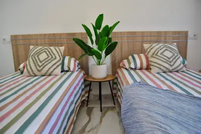 Cama o camas de una habitación en Villa Puerto Rico in front of the shopping center with private heated saltwater pool with jacuzzi function & arcade games OR St andard Villa Puerto Rico in front of the shopping center with private heated saltwater large jacuzzi No Pool& arcade games