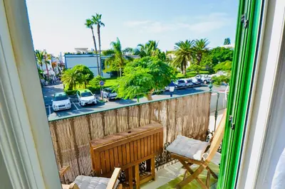 Un balcón o terraza de Casa Vivienne Perfectly Located Apartment With Roof Terrace In Puerto De Mogan Beach & Marina Gran Canaria