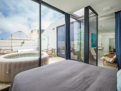 Cama o camas de una habitación en Las Palmas Beach Penthouse