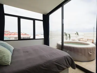 Cama o camas de una habitación en Las Palmas Beach Penthouse