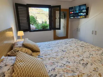 Cama o camas de una habitación en Vivienda Vacacional frente al mar Playa del Aguila