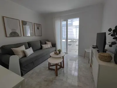 Una televisión o centro de entretenimiento en Nice cozy apartment near the dunes