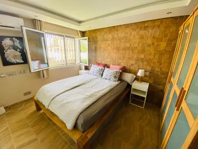 Cama o camas de una habitación en Puerto Rico duplex with community pool close to the beach