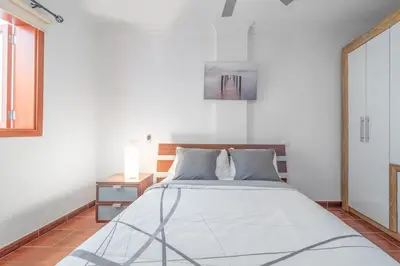 Cama o camas de una habitación en Encanto Arinaga