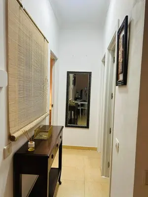 Una televisión o centro de entretenimiento en Comfortable Flat Near Las Canteras