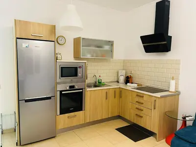 Una cocina o zona de cocina en Comfortable Flat Near Las Canteras