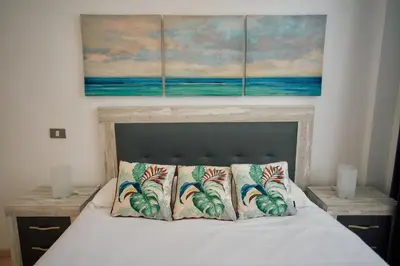 Cama o camas de una habitación en Canteras Beach Top Home