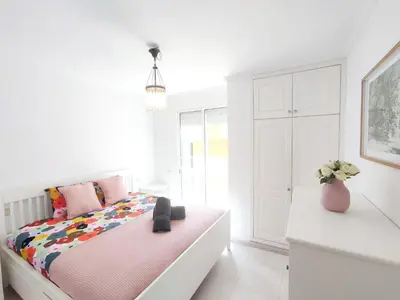 Cama o camas de una habitación en Pura Vida Beachfront Apartment