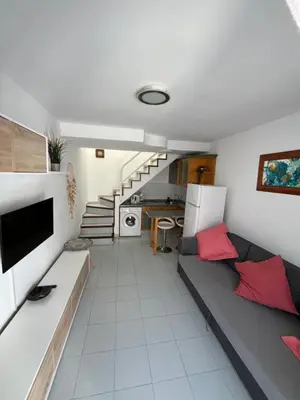 Una televisión o centro de entretenimiento en Casa Soleada Mañana