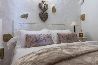 Cama o camas de una habitación en Casa Cueva Rural los Pastores