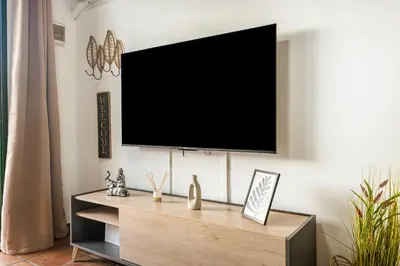 Una televisión o centro de entretenimiento en Paradise Dunas Maspalomas