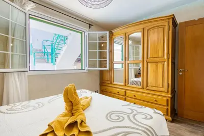 Cama o camas de una habitación en El Refugio de Aitana by Homestaygranacanaria