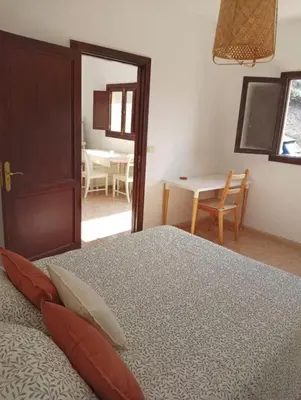 Cama o camas de una habitación en casa La cabaña Villa Palomino
