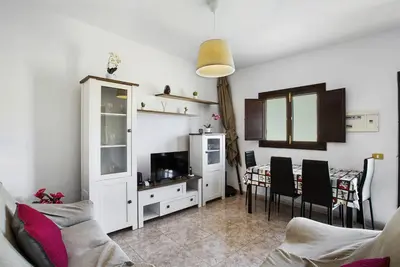 Una televisión o centro de entretenimiento en casa La cabaña Villa Palomino